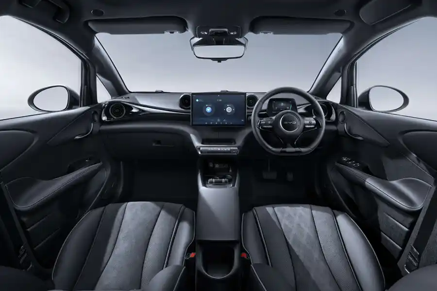 An image of BYD Dolphin EV Car showing its interior - Dashboard, Instrument Cluster, Seating